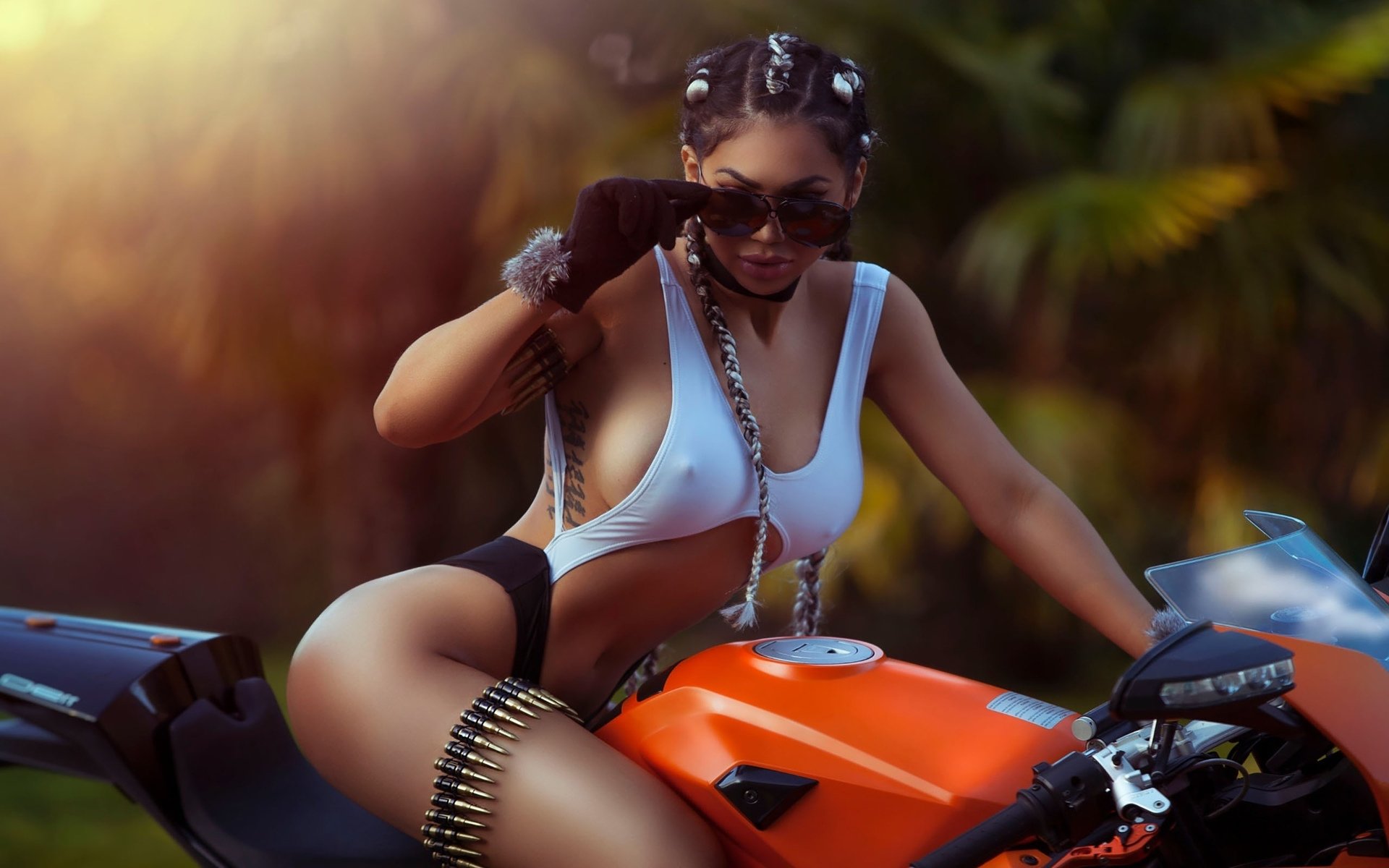 Take a pause and enjoy Girls with tattoos and motorcycles — streaming from Ngerulmud